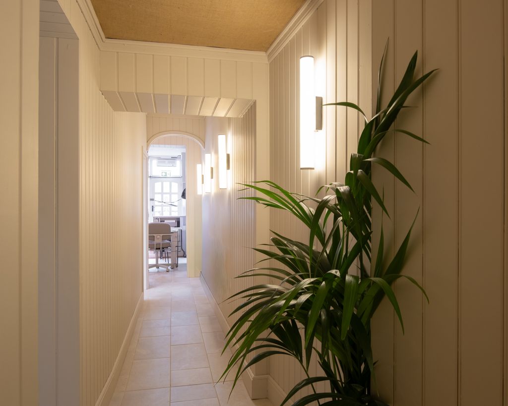 The panelled corridor leading to the treatment rooms at Skin & Co Morpeth