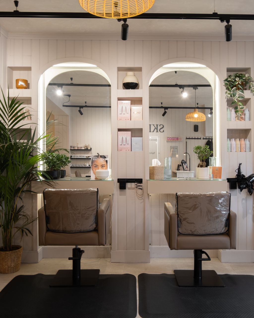Two arched, back-lit mirrors and styling stations at Skin & Co Morpeth